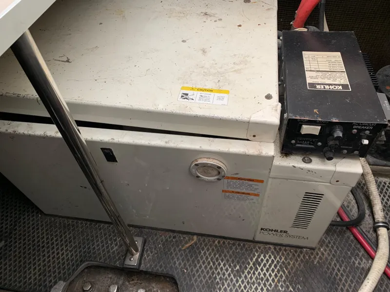 Slide: The Image of Kohler generator in a 2000 Chaparral Signature 300 boat, showing control panel and wiring. - 13