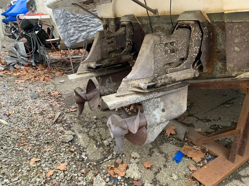 Slide: The Image of Twin propellers of a 2000 Chaparral Signature 300 boat on gravel. - 15