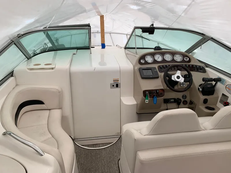 Slide: The Image of 2000 Chaparral Signature 300 boat interior with steering wheel and dashboard controls. - 3