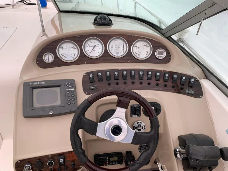 Slide: The Image of Control panel of 2000 Chaparral Signature 300 boat with gauges and steering wheel. - 4