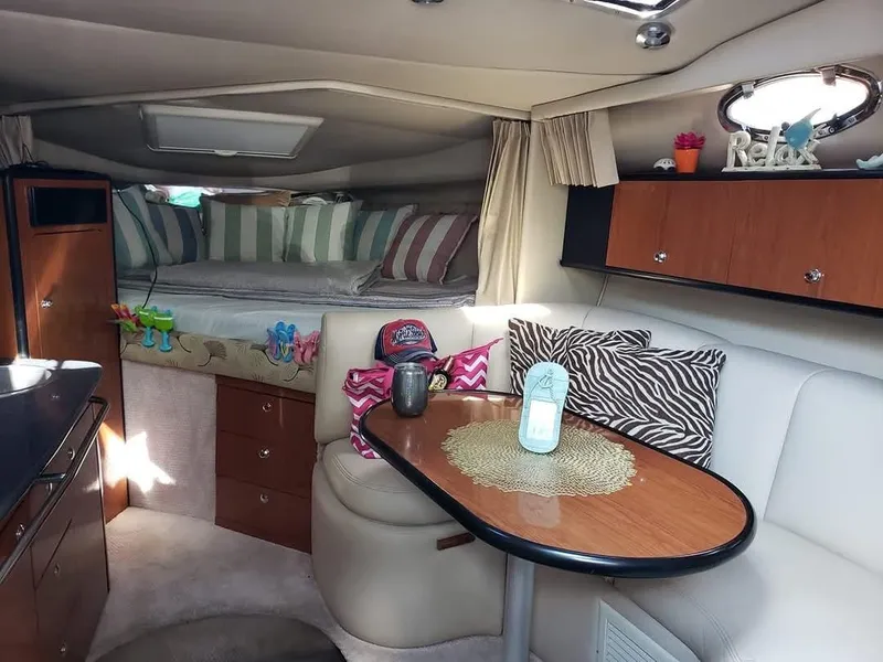 Slide: The Image of Interior of 2000 Chaparral Signature 300 boat with cozy seating and stylish decor. - 7