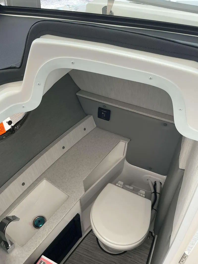 Slide: The Image of Interior of 2025 Cobalt R6 boat bathroom with sink and toilet. - 12