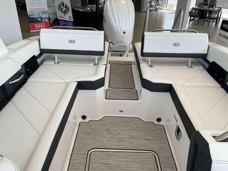 Slide: The Image of 2025 Cobalt R6 boat interior with white seating and modern design. - 13