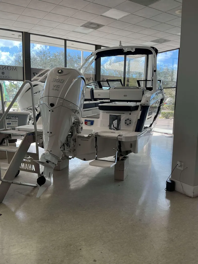 Slide: The Image of 2025 Cobalt R6 boat displayed indoors with Yamaha outboard motor. - 3