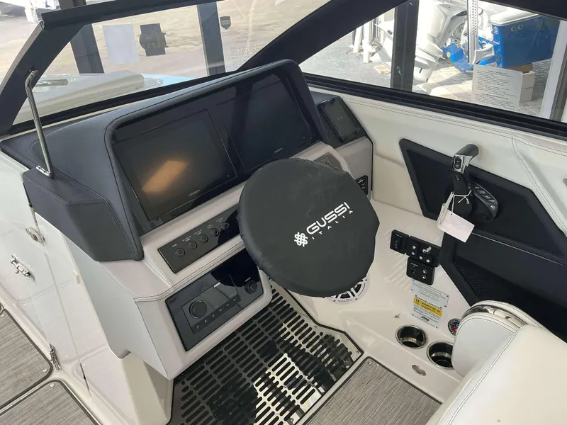Slide: The Image of 2025 Cobalt R6 boat cockpit with Gussi Italia steering wheel and modern controls. - 5