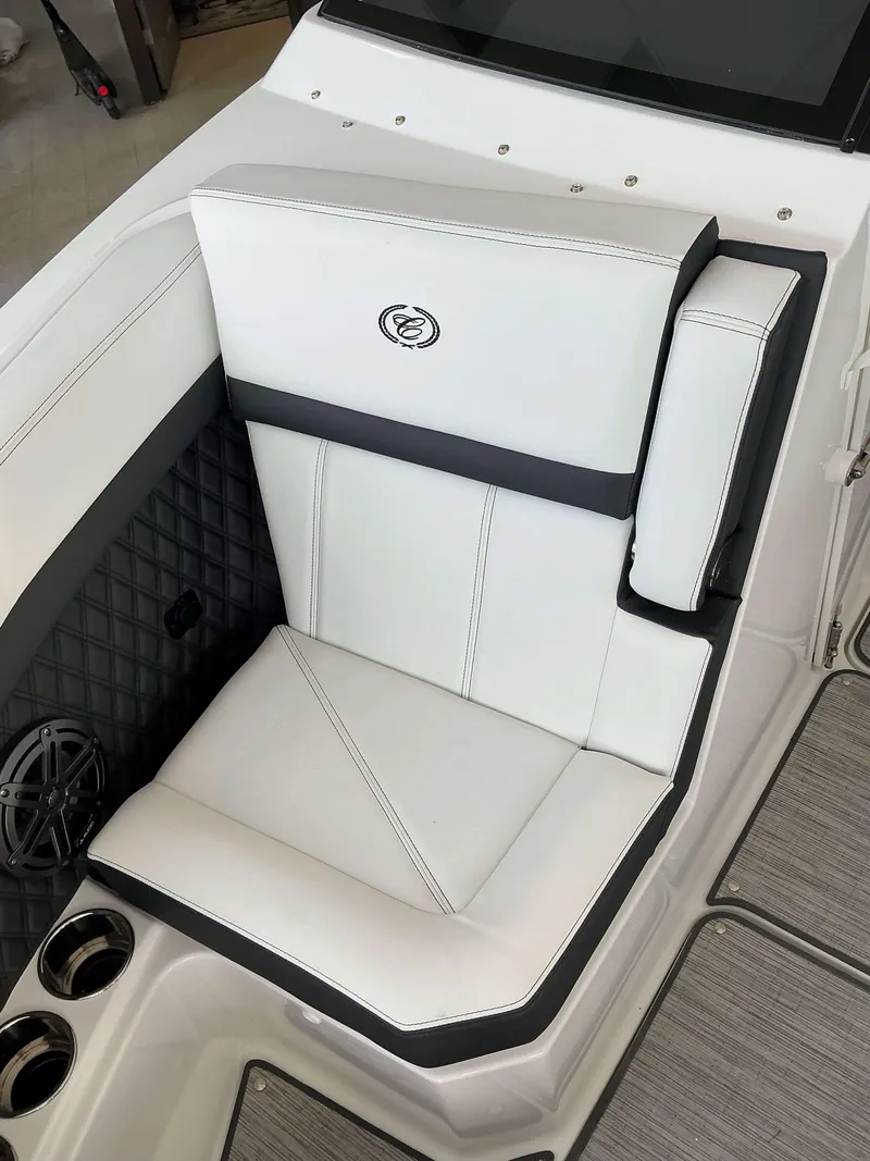 Slide: The Image of 2025 Cobalt R6 boat seat with white upholstery and integrated speaker. - 9
