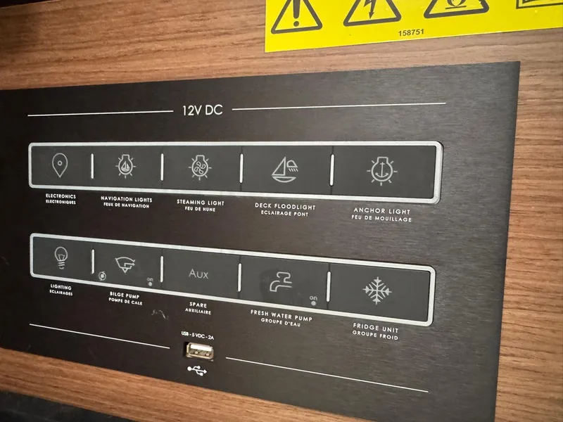 Slide: The Image of Vent on wooden panel inside 2024 Beneteau Oceanis 34.1 yacht. - 14