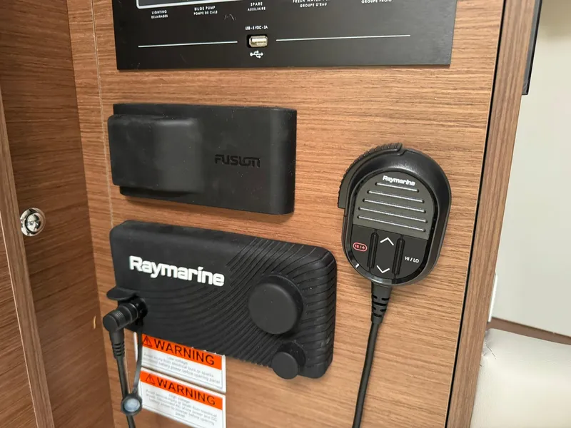 Slide: The Image of Control panel of 2024 Beneteau Oceanis 34.1 yacht with labeled switches and indicators. - 15