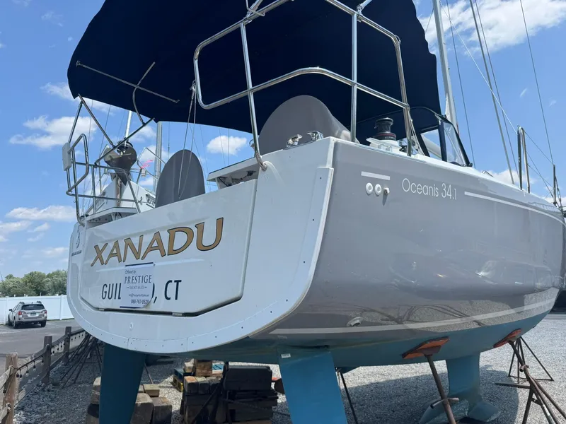 Slide: The Image of 2024 Beneteau Oceanis 34.1 sailboat "Xanadu" docked, featuring sleek design and modern amenities. - 28