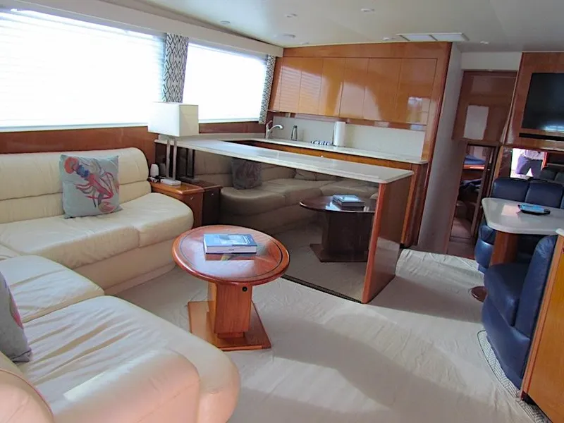 Slide: The Image of Luxurious interior of a 1999 Viking Convertible boat with elegant seating and modern amenities. - 30