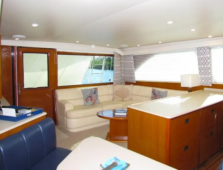 Slide: The Image of Luxurious interior of a 1999 Viking Convertible boat with elegant seating and decor. - 31