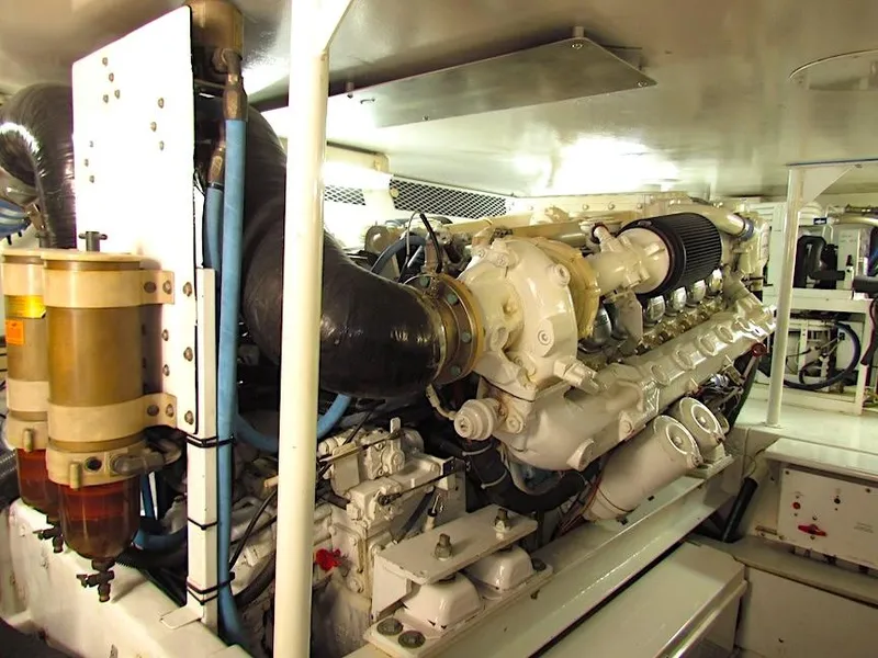 Slide: The Image of Engine room of a 1999 Viking Boats Convertible, showcasing detailed machinery and components. - 45