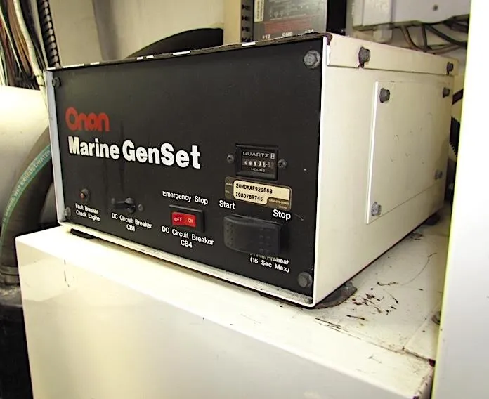 Slide: The Image of Onan Marine GenSet control panel on a 1999 Viking Convertible boat. - 46