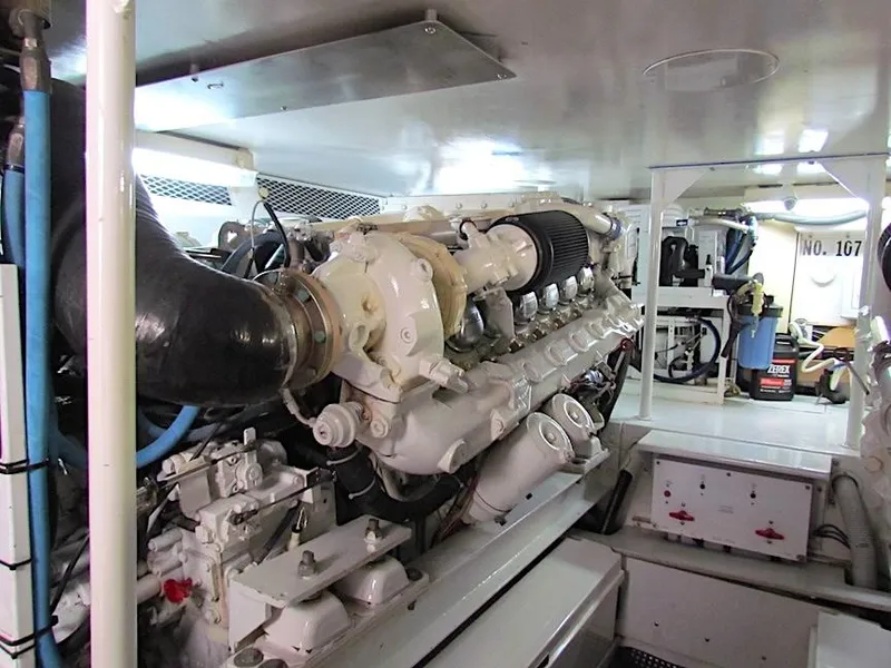 Slide: The Image of Engine room of a 1999 Viking Boats Convertible, showcasing detailed machinery and components. - 47