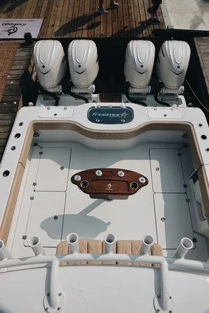 Slide: The Image of Freeman 38 boat deck with four engines, 2026 model, viewed from above. - 2