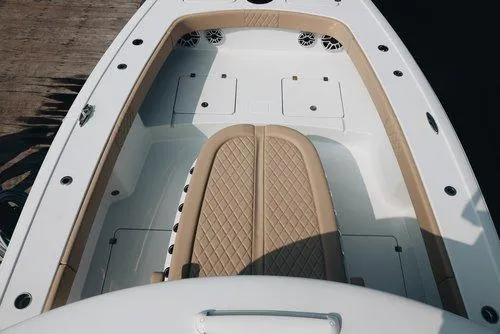 Slide: The Image of Luxurious interior of 2026 Freeman 38 boat with tan seating and white deck. - 3