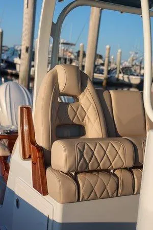 Slide: The Image of Luxurious seating on a 2026 Freeman 38 boat, featuring diamond-stitched upholstery. - 5