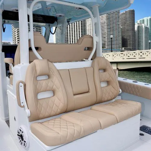 Slide: The Image of Luxurious seating on a 2026 Freeman 35 boat, with cityscape in the background. - 3