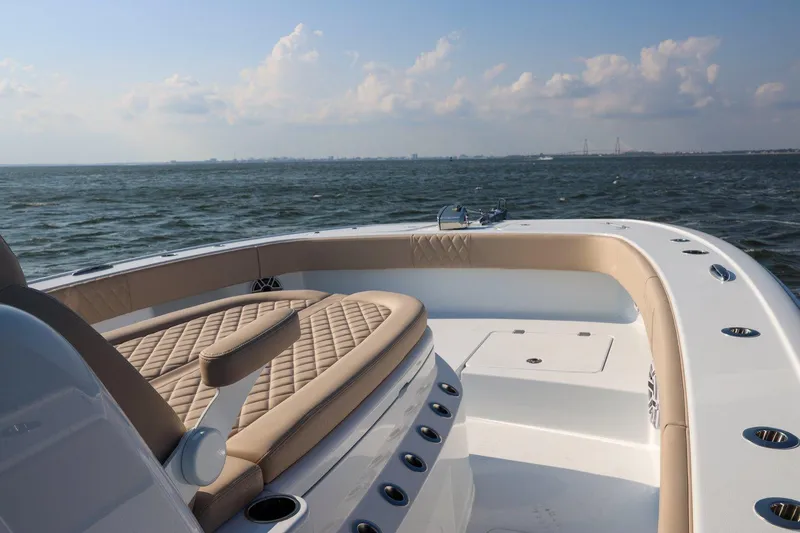 Slide: The Image of Freeman 35 boat, 2026 model, cruising on open water under a partly cloudy sky. - 5