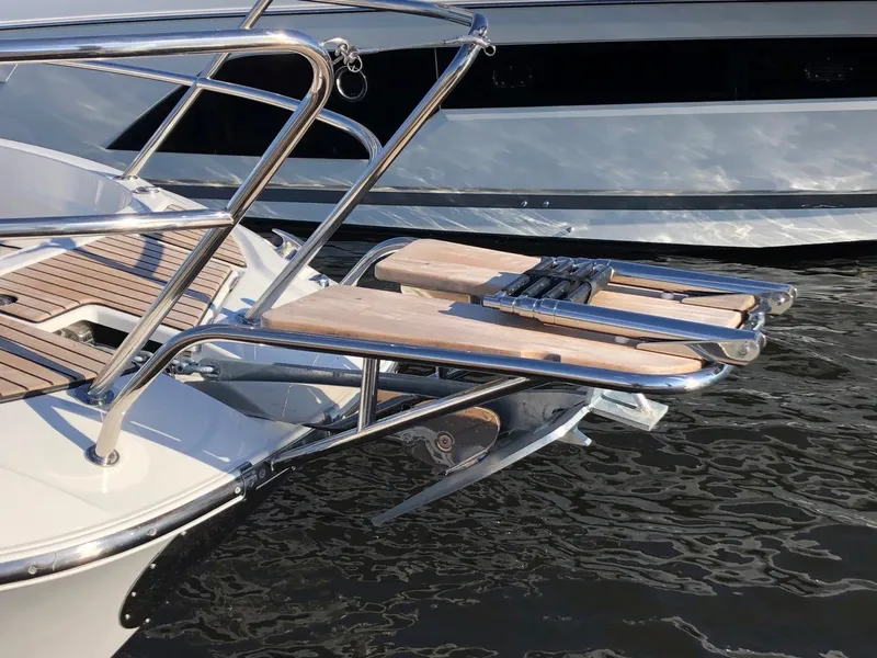 Slide: The Image of 2024 Jeanneau Leader 12.5 WA boat with stainless steel and wood swim platform. - 10