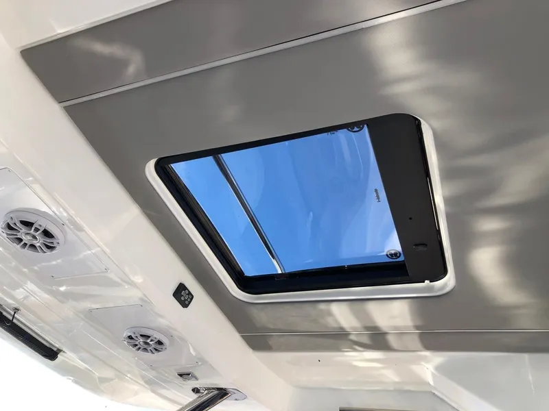 Slide: The Image of 2024 Jeanneau Leader 12.5 WA interior ceiling with skylight and speakers. - 18