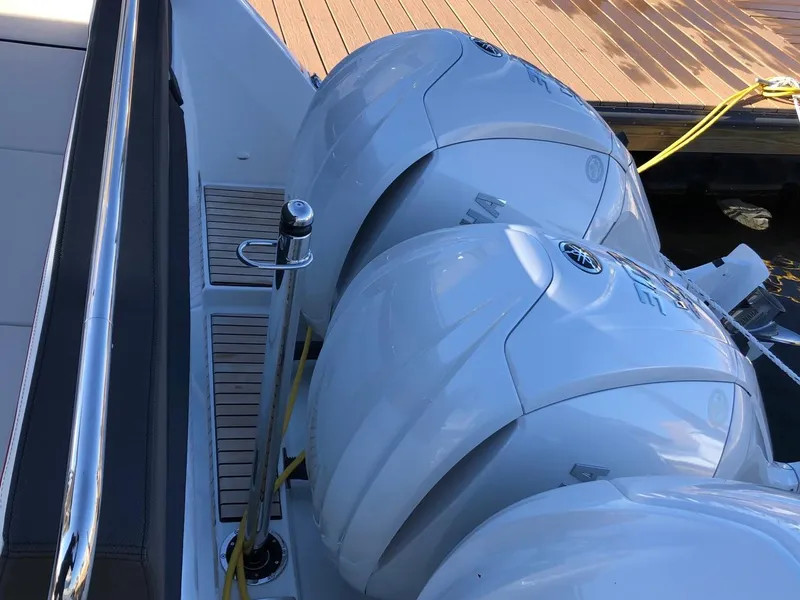 Slide: The Image of 2024 Jeanneau Leader 12.5 WA with dual outboard engines at dock. - 7