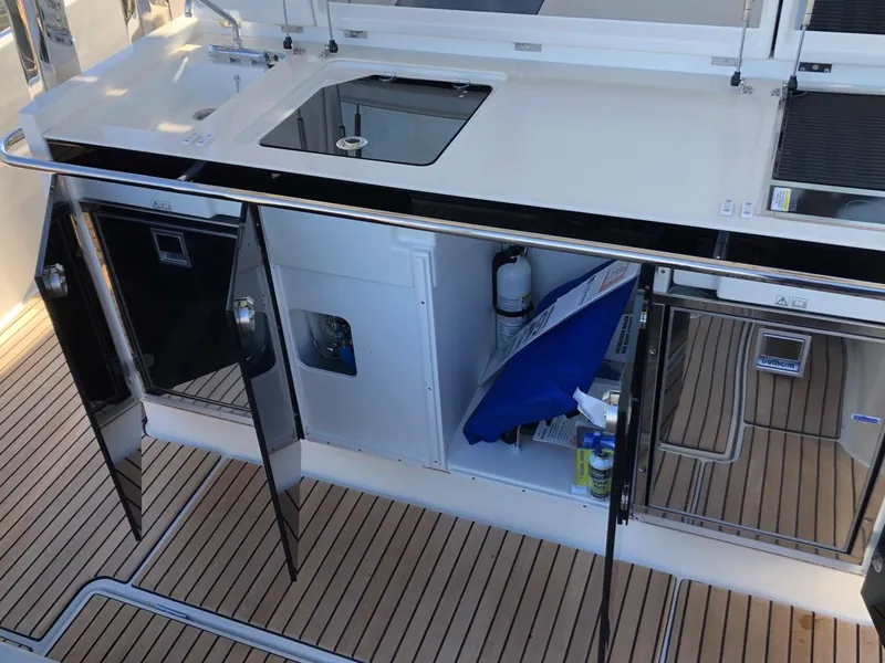 Slide: The Image of 2024 Jeanneau Leader 12.5 WA yacht kitchen area with open storage and sleek design. - 8