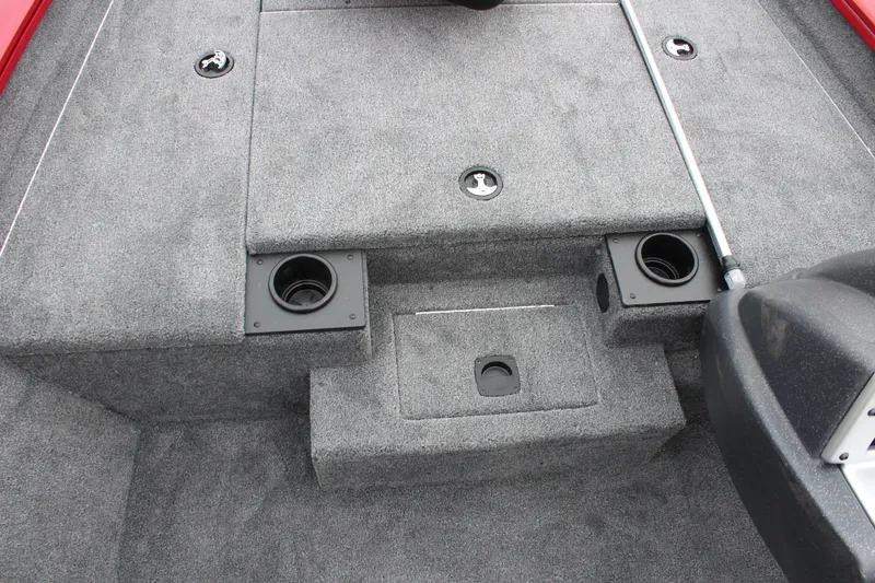 Slide: The Image of 2025 Tracker PT 175 TXW boat interior with carpeted deck and storage compartments. - 10