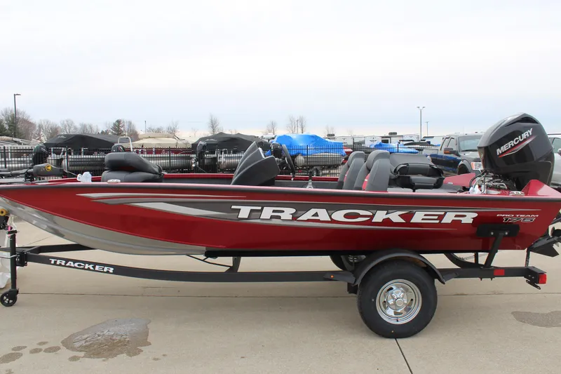 Slide: The Image of 2025 Tracker PT 175 TXW boat in red, parked on a trailer. - 3