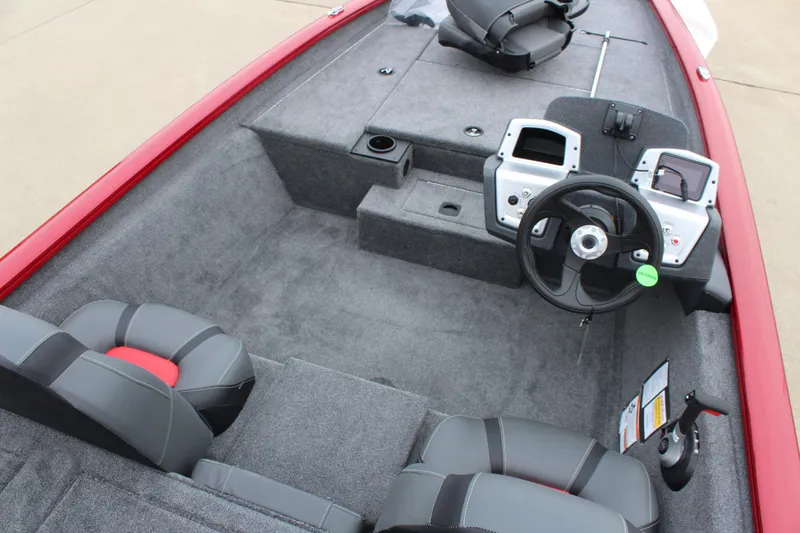 Slide: The Image of 2025 Tracker PT 175 TXW boat interior with steering wheel and seating. - 5