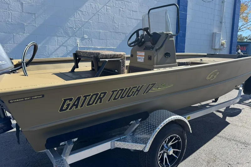 Slide: The Image of 2025 G3 Gator Tough 17 CC boat on trailer, side view. - 9