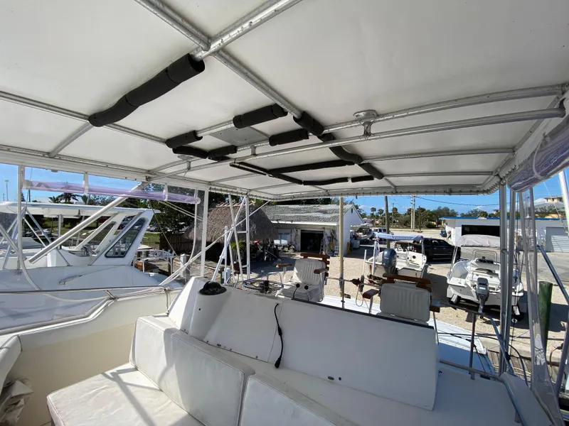 Slide: The Image of 1982 Bertram 46.6 War Wagon boat interior with seating and canopy. - 15