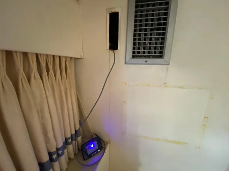 Slide: The Image of Interior of 1982 Bertram 46.6 War Wagon with curtain, vent, and electronic device. - 31