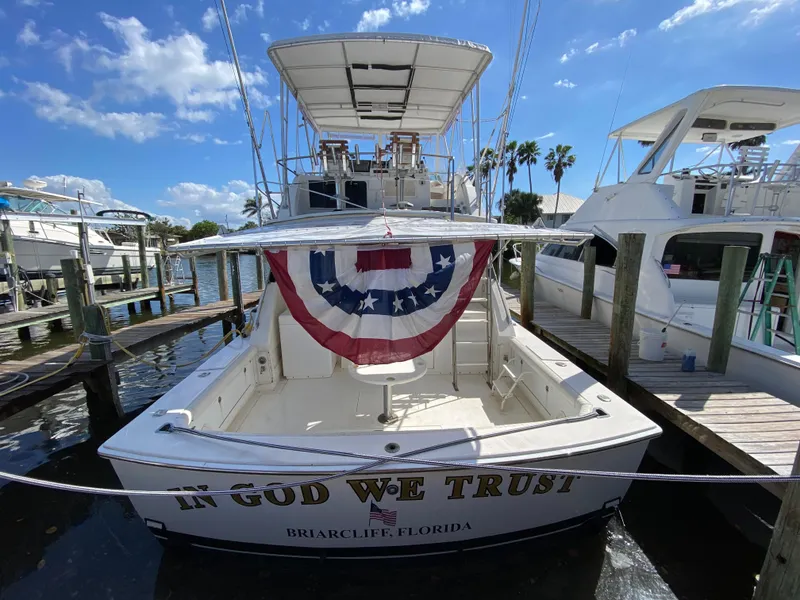 Slide: The Image of 1982 Bertram 46.6 War Wagon boat docked, adorned with patriotic bunting, Briarcliff, Florida. - 1