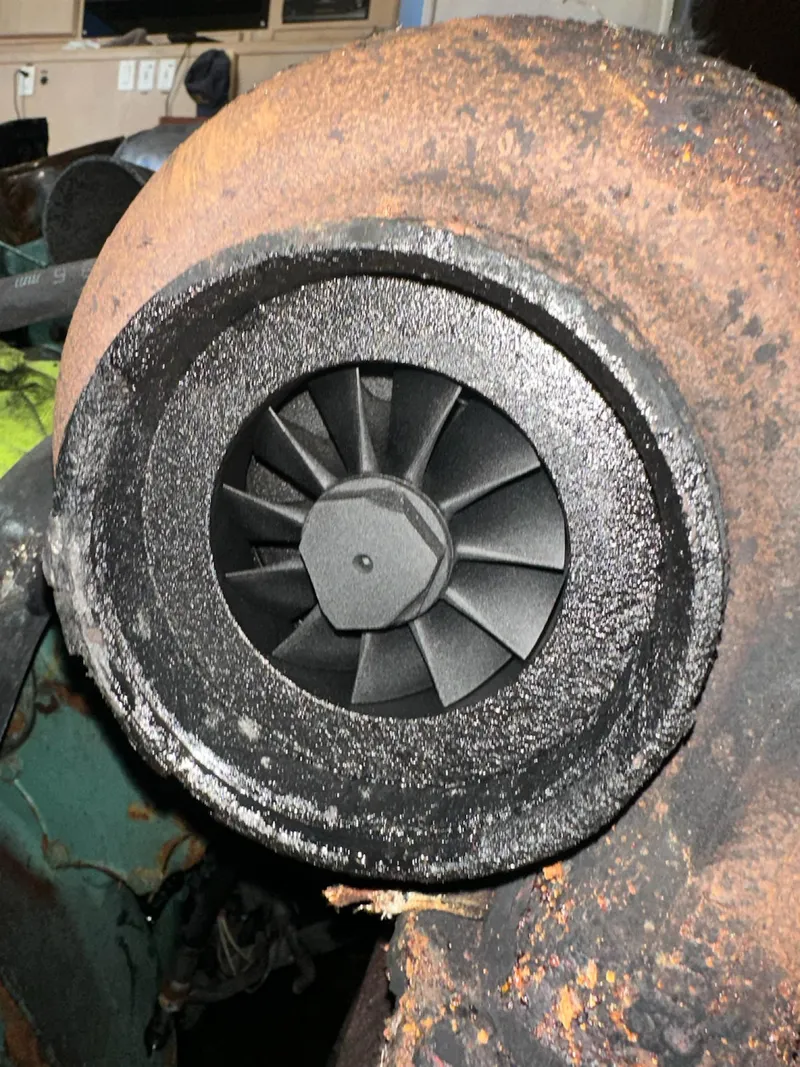 Slide: The Image of Rusty turbocharger of a 1982 Bertram 46.6 War Wagon boat engine. - 48