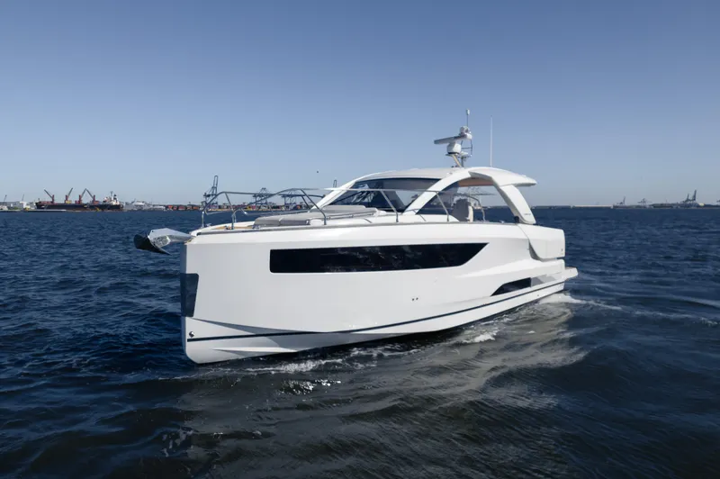 Slide: The Image of 2024 Jeanneau DB/43 OB yacht with elegant teak deck and luxurious seating area. - 20