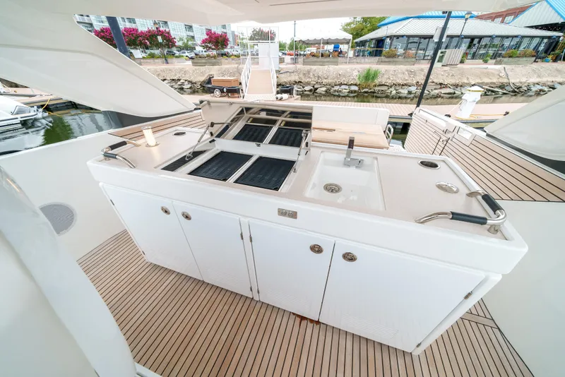 Slide: The Image of 2024 Jeanneau DB/43 OB yacht docked at a marina, showcasing sleek design and modern features. - 26