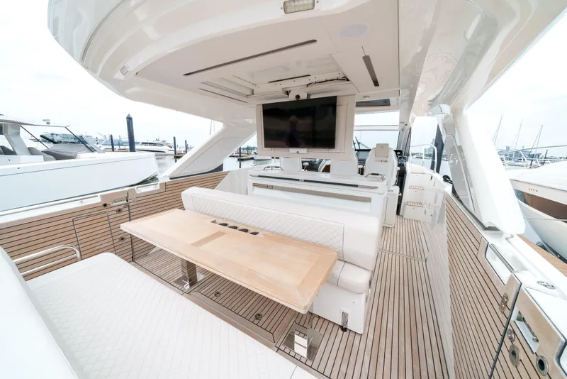 Slide: The Image of 2024 Jeanneau DB/43 OB yacht cockpit with modern controls and luxurious seating. - 32