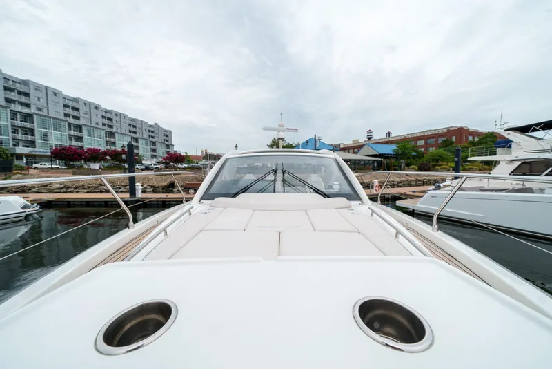 Slide: The Image of 2024 Jeanneau DB/43 OB yacht docked at a marina, showcasing sleek design and modern features. - 39