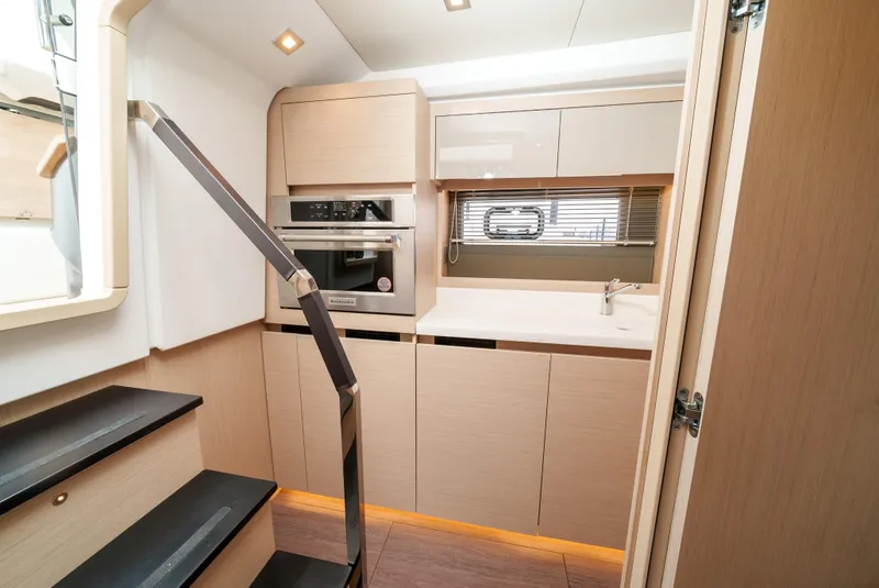 Slide: The Image of Modern kitchen interior of 2024 Jeanneau DB/43 OB yacht with sleek cabinetry and appliances. - 48