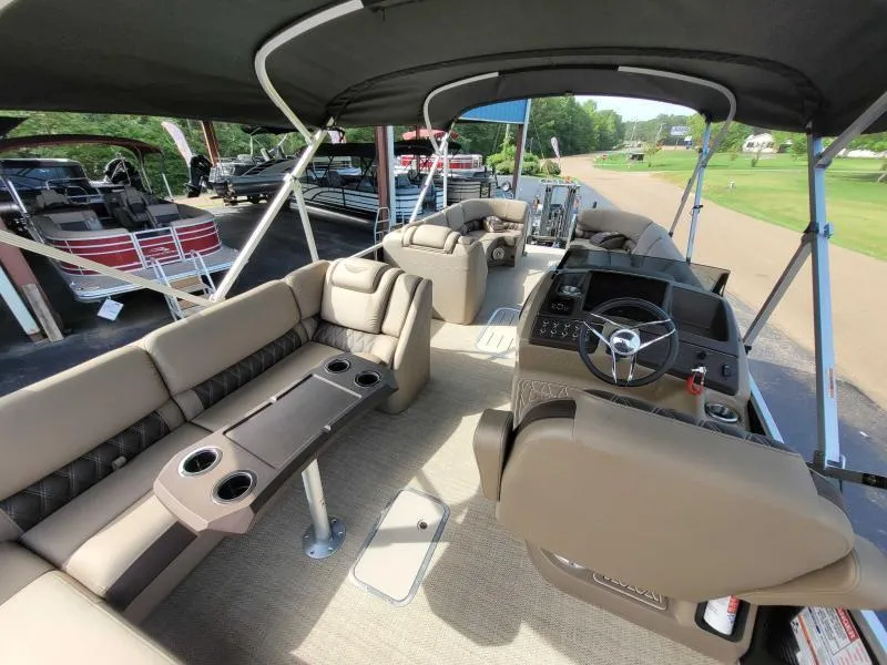 Slide: The Image of 2024 Bennington 25 RSB pontoon boat interior with luxurious seating and modern helm. - 11