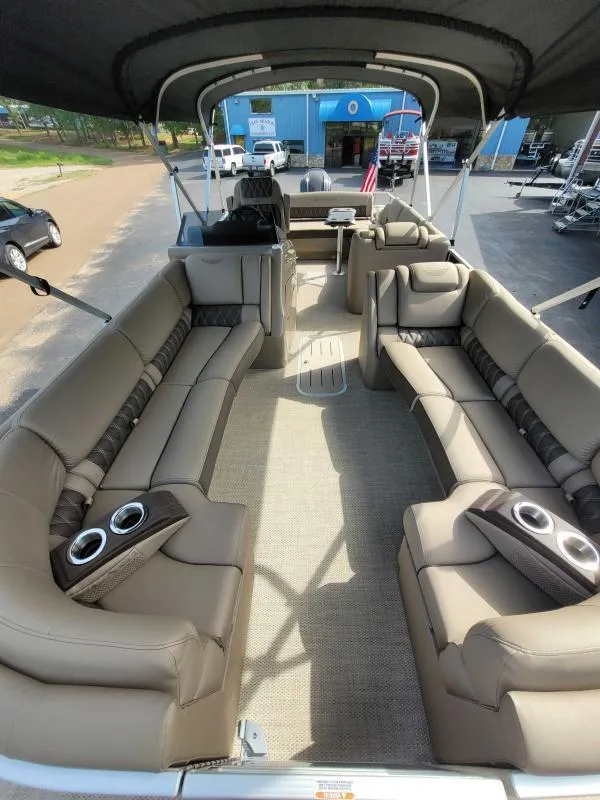Slide: The Image of 2024 Bennington 25 RSB pontoon boat with spacious seating and modern design. - 5