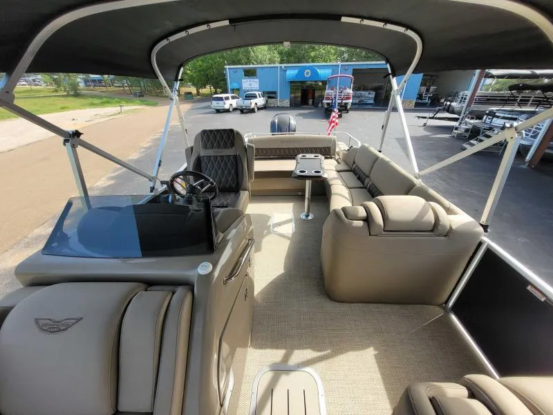 Slide: The Image of 2024 Bennington 25 RSB pontoon boat interior with luxurious seating and helm. - 6