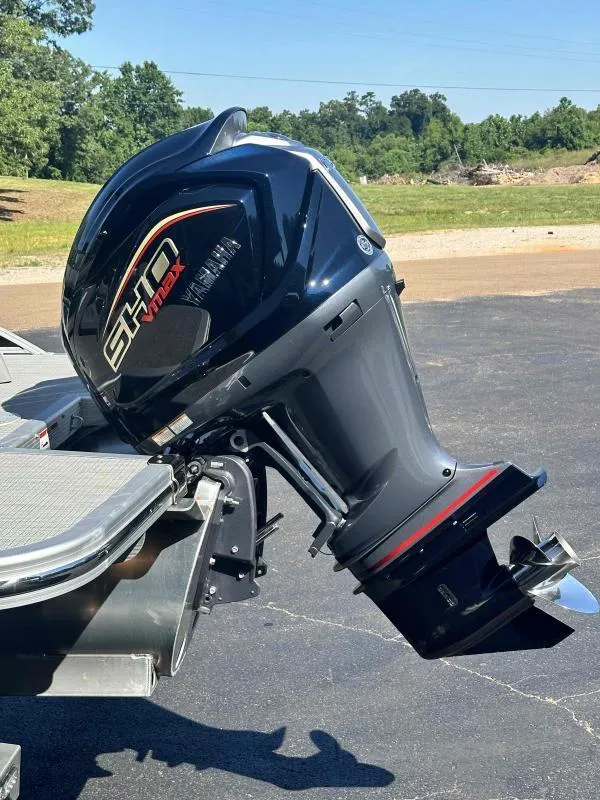 Slide: The Image of 2024 Bennington 23RSB with Yamaha VF250XB outboard motor, parked outdoors. - 3