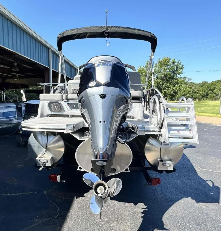 Slide: The Image of 2024 Bennington 23RSB boat with Yamaha VF250XB engine, parked outdoors. - 5