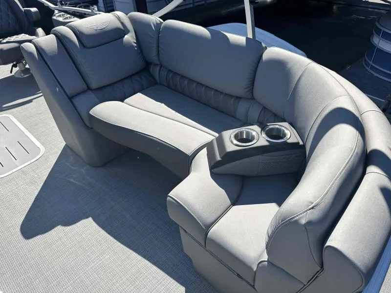 Slide: The Image of 2024 Bennington 23RSB boat interior with gray seating and cup holders. - 8