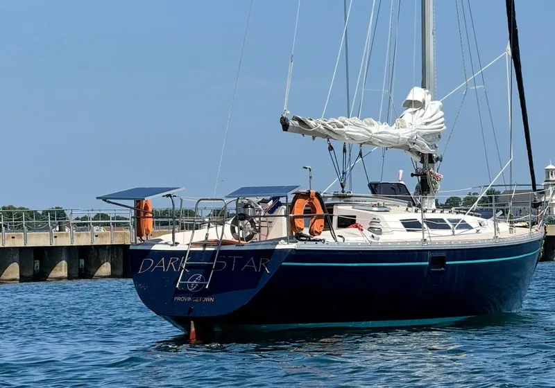 The Image of 1983 O'Day 39 sailboat named "Dark Star" docked in calm waters. - 0