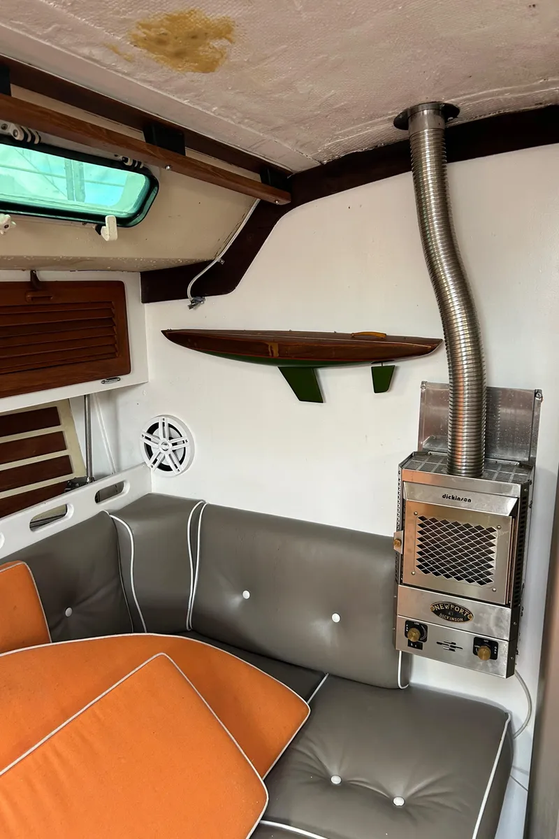 Slide: The Image of Interior of 1983 O'Day 39 sailboat with cozy seating and a compact heater. - 11