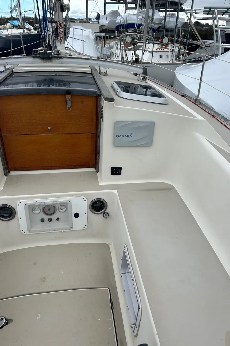 Slide: The Image of 1983 O'Day 39 sailboat cockpit with wooden hatch and control panel. - 17