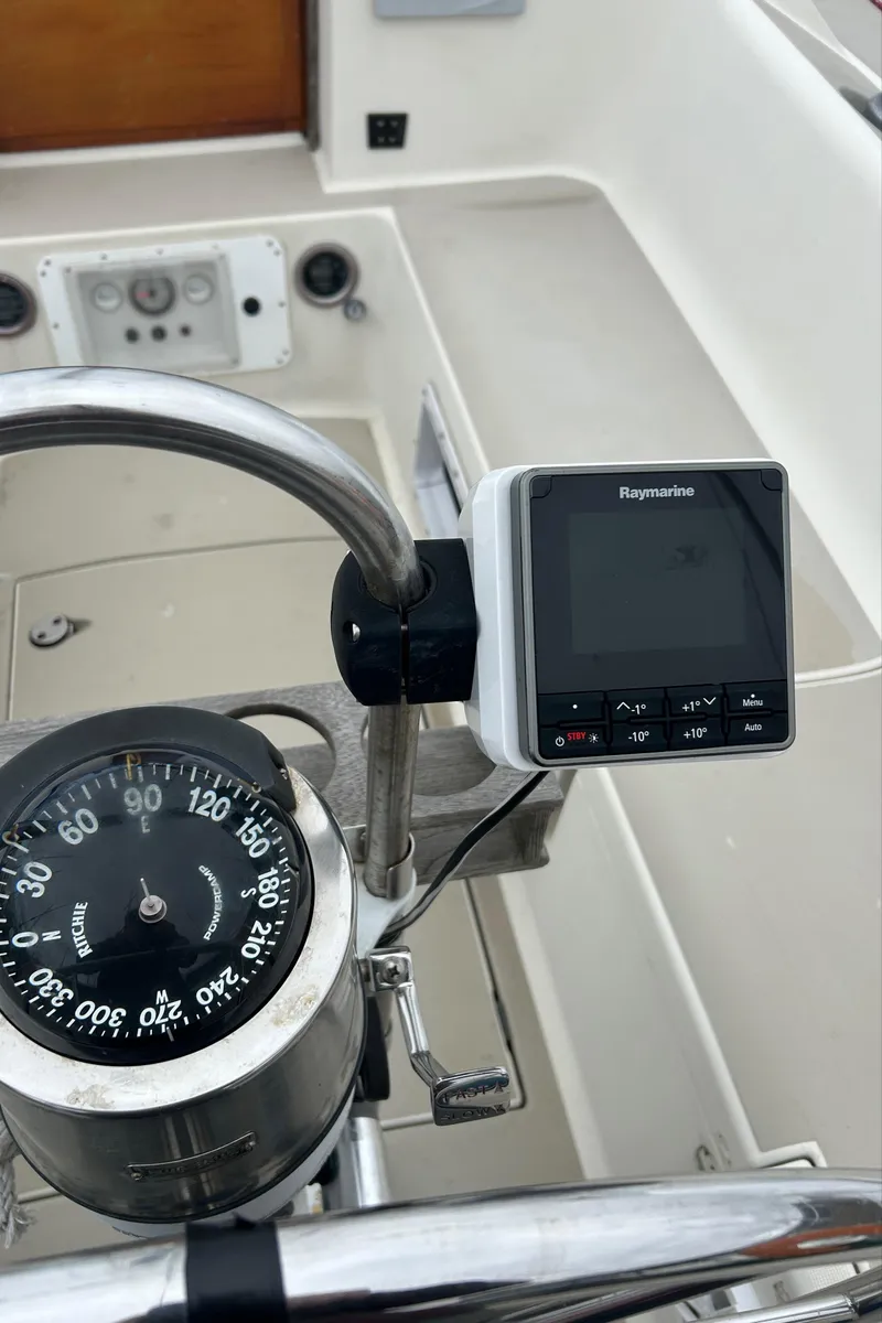 Slide: The Image of Cockpit of 1983 O'Day 39 sailboat with compass and Raymarine display. - 29